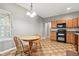 Eat-in kitchen boasts light wood cabinetry, modern appliances, and cozy dining area with great natural light at 19489 Prairie Crossing Dr, Noblesville, IN 46062