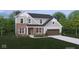 Charming two-story home with brick and siding and lush landscaping, featuring a two-car garage at 19976 Stone Side Dr, Westfield, IN 46074
