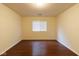 A bedroom with smooth surface floors and a window for natural lighting at 209 Faulkner Ct # 102, Carmel, IN 46032