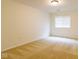 This bedroom features neutral walls, carpet, one window with blinds, and a flush mount light at 209 Faulkner Ct # 102, Carmel, IN 46032