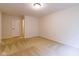 This bedroom features neutral walls, carpet, and a door to the adjacent room at 209 Faulkner Ct # 102, Carmel, IN 46032