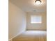 This bedroom features neutral walls, carpet, and one window with blinds at 209 Faulkner Ct # 102, Carmel, IN 46032