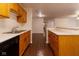 Kitchen view showing sink and appliances along with an open floor plan at 209 Faulkner Ct # 102, Carmel, IN 46032