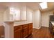Kitchen with a peninsula, hardwood floors, oak cabinets and stainless steel appliances at 209 Faulkner Ct # 102, Carmel, IN 46032