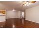 Open floor plan with hardwood floors and a view of the kitchen at 209 Faulkner Ct # 102, Carmel, IN 46032