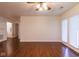 Living room with hardwood floors offering an open-concept layout and lots of space at 209 Faulkner Ct # 102, Carmel, IN 46032
