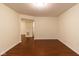 Open-concept living room with smooth surface floors and natural light at 209 Faulkner Ct # 102, Carmel, IN 46032