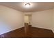 Open-concept living room with smooth surface floors and natural light at 209 Faulkner Ct # 102, Carmel, IN 46032