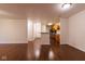 Open concept living area with hardwood floors flowing into the kitchen at 209 Faulkner Ct # 102, Carmel, IN 46032