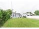 Well-maintained backyard with lush green grass and privacy hedges surrounding the home at 2249 Maple St, Columbus, IN 47201