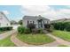 Charming single Gathering home featuring manicured landscaping, black shutters, and a covered front porch at 2249 Maple St, Columbus, IN 47201