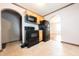 A kitchen showcasing black appliances and light wood cabinets, seamlessly adjoining another room at 2249 Maple St, Columbus, IN 47201