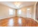 Inviting living room featuring hardwood floors, two large windows, and a ceiling fan at 2249 Maple St, Columbus, IN 47201