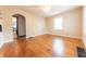 Bright living room with hardwood floors and ample natural light from two windows at 2249 Maple St, Columbus, IN 47201