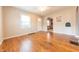 Open living room featuring hardwood floors and natural light from a double window at 2249 Maple St, Columbus, IN 47201
