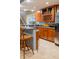 Basement bar boasts granite countertops, wood cabinetry, wine storage and stainless steel refrigerator at 23119 Sonoma Ln, Cicero, IN 46034