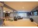 Finished basement with leather sofa, ping pong table, golf game and multiple TVs at 23119 Sonoma Ln, Cicero, IN 46034
