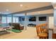 The finished basement features a bar with stools, a lounge area, a ping pong table, and TVs at 23119 Sonoma Ln, Cicero, IN 46034