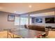 Finished basement features a ping pong table, a comfortable seating area, and wall-mounted TVs at 23119 Sonoma Ln, Cicero, IN 46034
