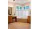 Bright bathroom featuring double vanities, a soaking tub, and a large window for natural light at 23119 Sonoma Ln, Cicero, IN 46034