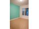 Clean and bright bedroom with neutral carpet, teal accent wall and a window with views at 23119 Sonoma Ln, Cicero, IN 46034