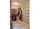 Walk-in closet with rods for hanging clothes and built in shelving at 23119 Sonoma Ln, Cicero, IN 46034