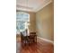 Bright dining area with hardwood floors, large window, and stylish chandelier at 23119 Sonoma Ln, Cicero, IN 46034