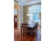 Elegant dining room featuring hardwood floors, large window, and a stylish light fixture at 23119 Sonoma Ln, Cicero, IN 46034