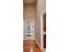 A warm and inviting entryway with hardwood flooring, built-in shelving and a cozy bench at 23119 Sonoma Ln, Cicero, IN 46034