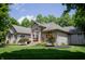 Attractive brick home featuring a manicured lawn, colorful flowerbeds, and inviting entrance at 23119 Sonoma Ln, Cicero, IN 46034