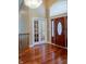 Welcoming foyer featuring hardwood floors, decorative front door and transom window above the door at 23119 Sonoma Ln, Cicero, IN 46034