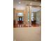Elegant foyer with hardwood floors, columns, and a chandelier at 23119 Sonoma Ln, Cicero, IN 46034