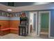Basement game room includes arcade games, seating, wet bar and access to a full bathroom at 23119 Sonoma Ln, Cicero, IN 46034
