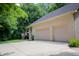 Spacious two-car garage with a wide driveway and brick exterior, blending convenience with classic style at 23119 Sonoma Ln, Cicero, IN 46034