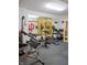 Home gym filled with various exercise equipment, a large mirror, and rubber flooring at 23119 Sonoma Ln, Cicero, IN 46034