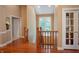Hallway with beautiful hardwood floors, french doors and plenty of natural light at 23119 Sonoma Ln, Cicero, IN 46034
