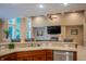 Kitchen with granite countertops, a stainless steel dishwasher, and an island with seating at 23119 Sonoma Ln, Cicero, IN 46034