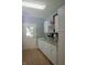 Laundry room with white cabinets, granite countertops and a door to the exterior at 23119 Sonoma Ln, Cicero, IN 46034