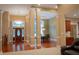 Spacious open-concept features hardwood floors, dining area, and a view of the front entryway at 23119 Sonoma Ln, Cicero, IN 46034