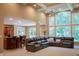 Spacious living room with coffered ceilings, large windows, and a comfortable sectional sofa at 23119 Sonoma Ln, Cicero, IN 46034