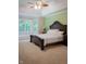 Comfortable main bedroom with carpet floors, large windows, and a decorative ceiling fan at 23119 Sonoma Ln, Cicero, IN 46034