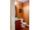 Powder room features a decorative sink, copper colored walls and hardwood floors at 23119 Sonoma Ln, Cicero, IN 46034