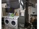 Basement utility area featuring washer, dryer, water heater, and furnace at 2412 Mars Hill St, Indianapolis, IN 46241