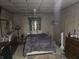 Modest bedroom featuring wood paneled walls, a ceiling fan, and vintage decor at 2412 Mars Hill St, Indianapolis, IN 46241