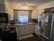 Well-lit kitchen featuring modern appliances, countertop space, and ample storage at 2412 Mars Hill St, Indianapolis, IN 46241