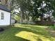 Large back yard with plenty of sunlight and a partial fence at 2631 Mcleay Dr, Indianapolis, IN 46220