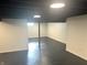 Large basement space perfect for storage or future expansion, with painted floors and walls at 2631 Mcleay Dr, Indianapolis, IN 46220