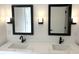 Modern bathroom featuring a double vanity, sleek fixtures, and updated lighting at 2631 Mcleay Dr, Indianapolis, IN 46220