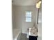 This bathroom includes modern subway tile, a bath and shower, and updated fixtures at 2631 Mcleay Dr, Indianapolis, IN 46220