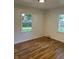 This bright bedroom boasts gleaming hardwood floors and two windows that bring in lots of natural light at 2631 Mcleay Dr, Indianapolis, IN 46220